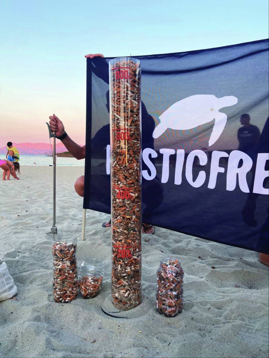 Piles of cigarettes collected on a beach